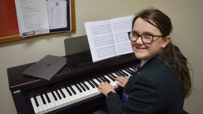 pupil playing the piano