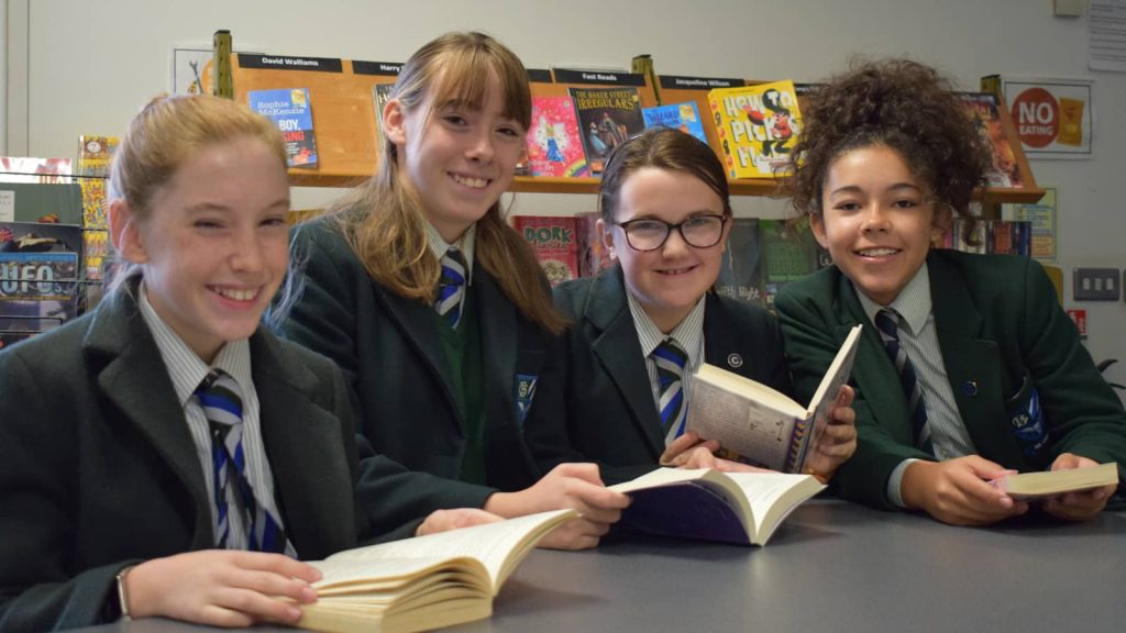 pupils in library reading books