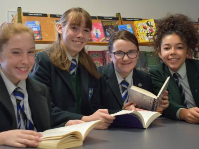 pupils in library reading books