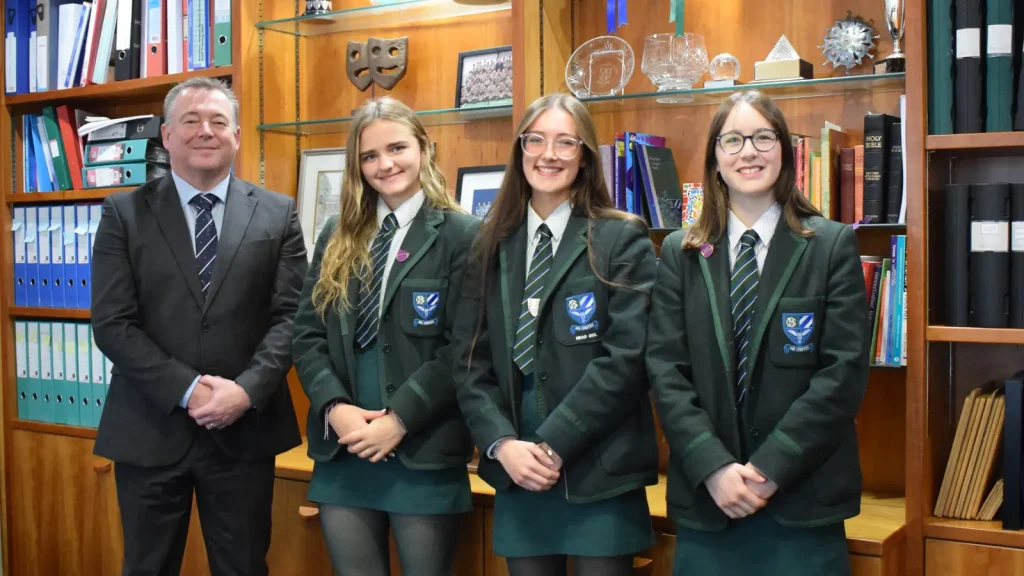 principal with tom team of pupils