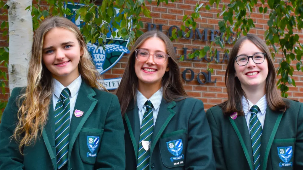 pupils posing outside school