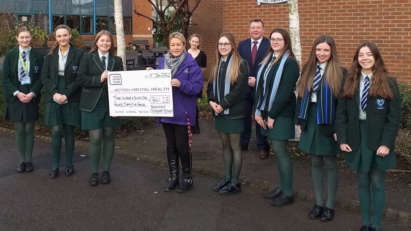 pupils presenting the cheque